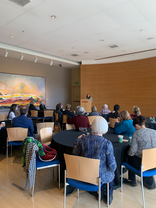 An image of a group of museum members in the auditorium