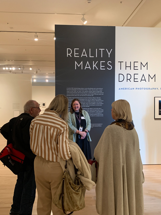 An image of a group of museum members inside a gallery