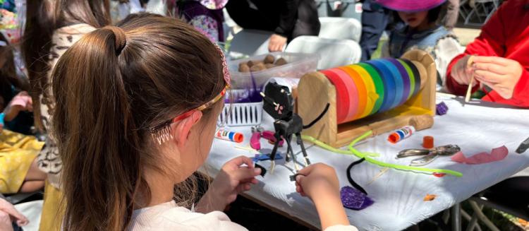 An image of a girl engaged in arts and crafts during Family Day