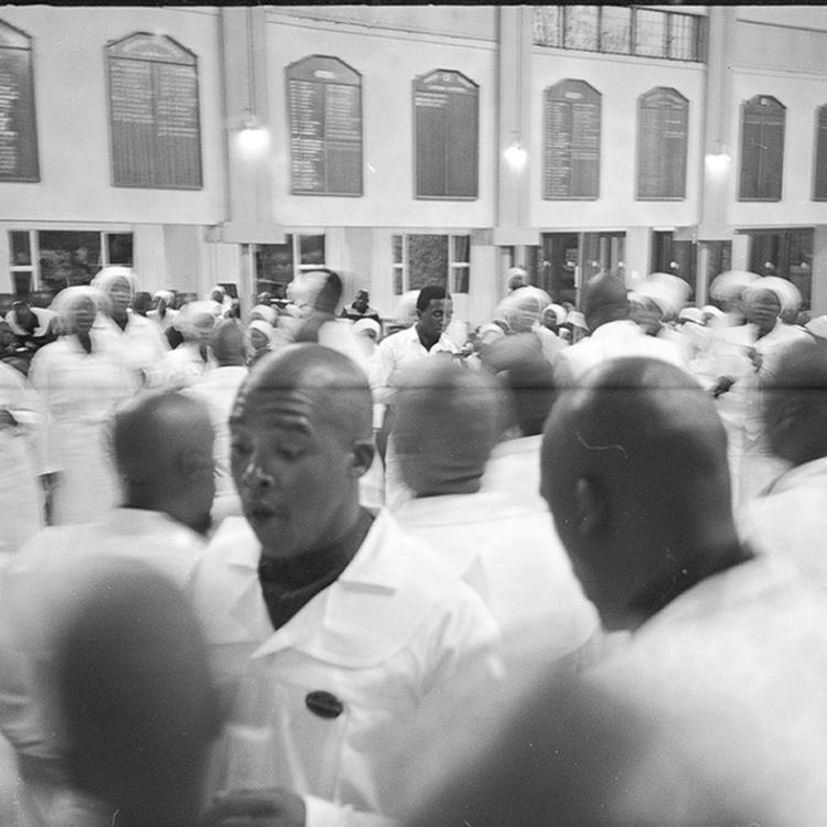 A black and white photograph depicting black people at high school
