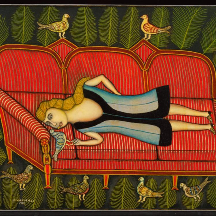 an image of a couch and a woman with two birds