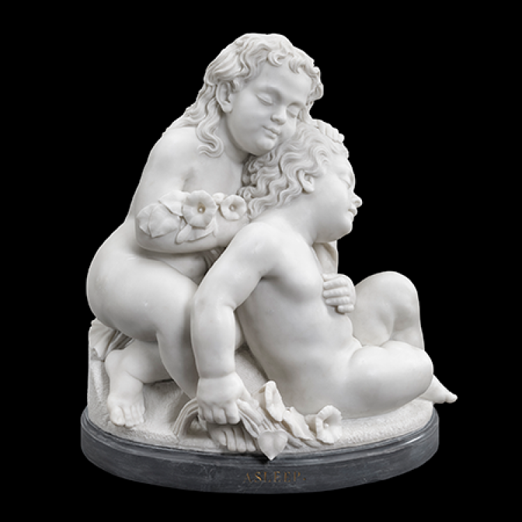 a marble sculpture of two small children