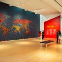 Visitors walk past Reena Saini Kallat's piece "Woven Chronicle" (2011-2019) in the temporary exhibition "When Home Won’t Let You Stay: Migration through Contemporary Art" in the Cantor Arts Center at Stanford University. Courtesy Andrew Brodhead/Stanford University.
