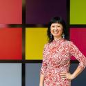 woman against colored squares backdrop