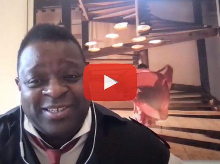 Artist Isaac julien smiling during a digital event