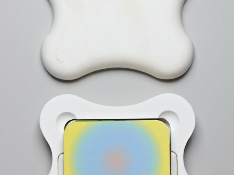 An image of a deck of cards inside a white container