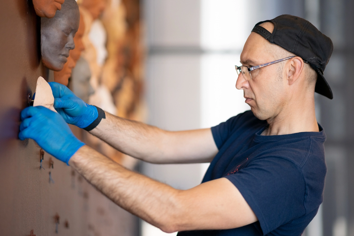 preparator installing exhibition