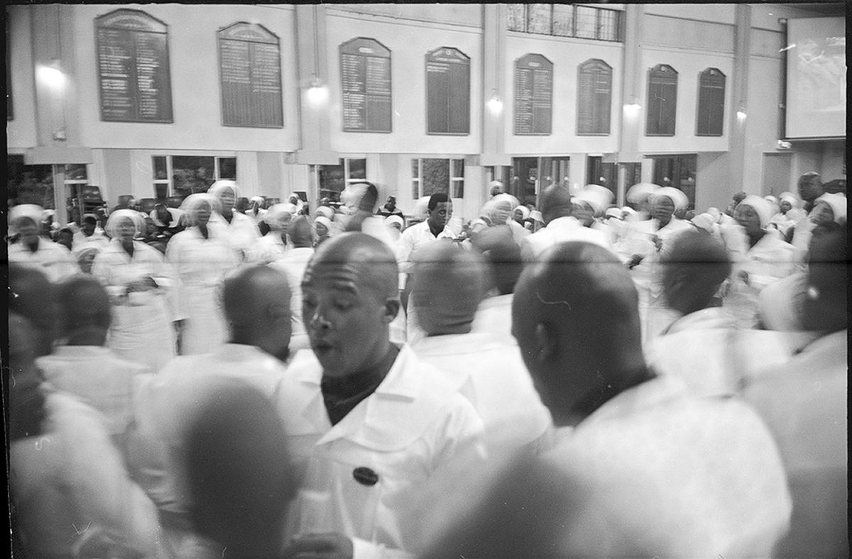 A black and white photograph depicting black people at high school