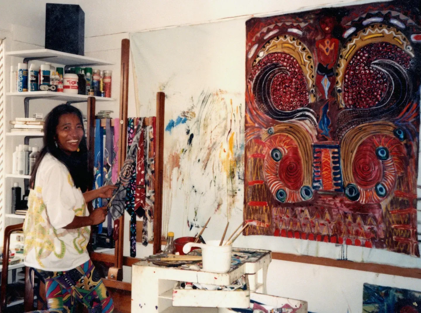 A woman artist and her work in her studio