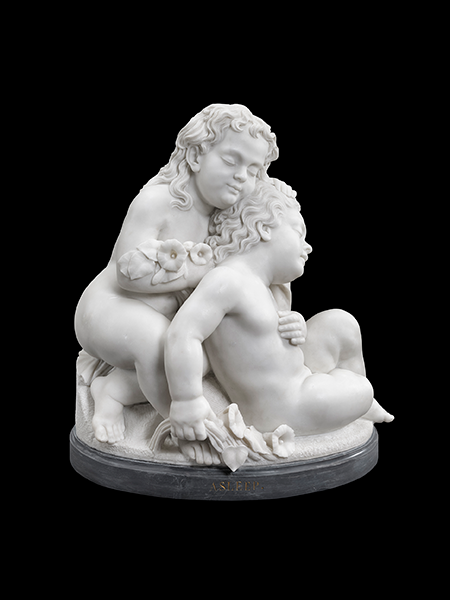 a marble sculpture of two small children